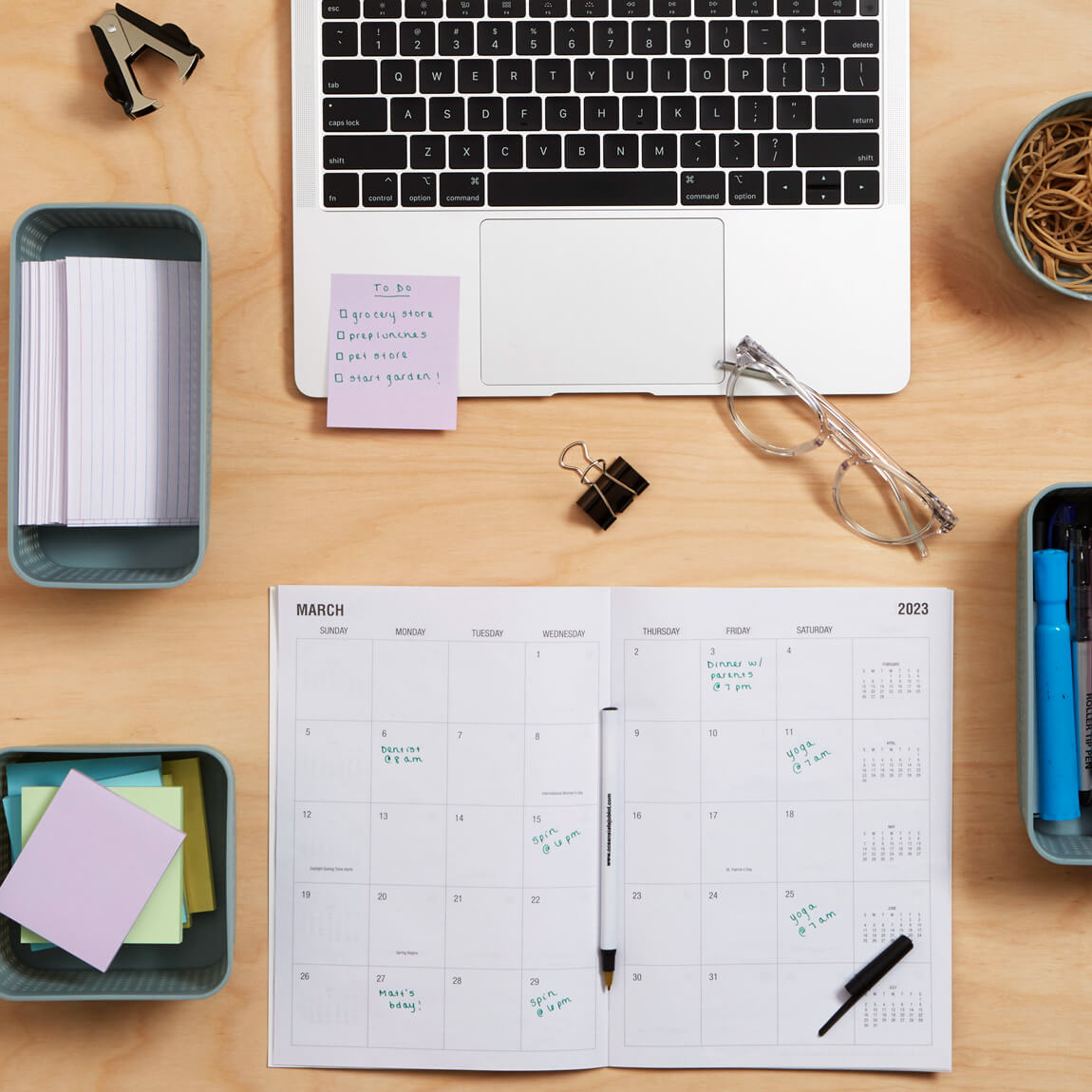 Decorative: Laptop and desk calendar.