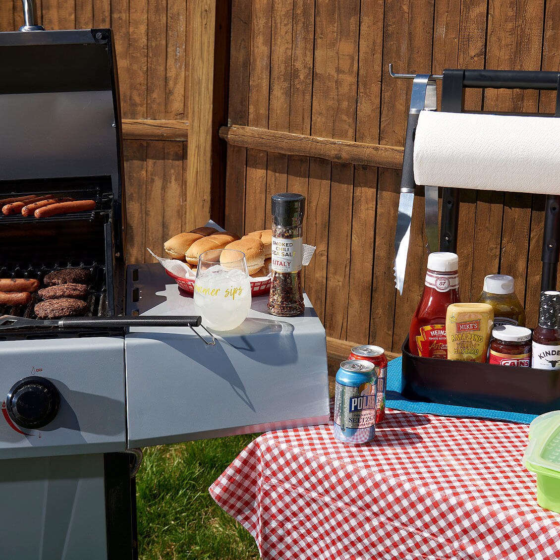 Decorative: Grilling hamburgers and hotdogs with condiments.